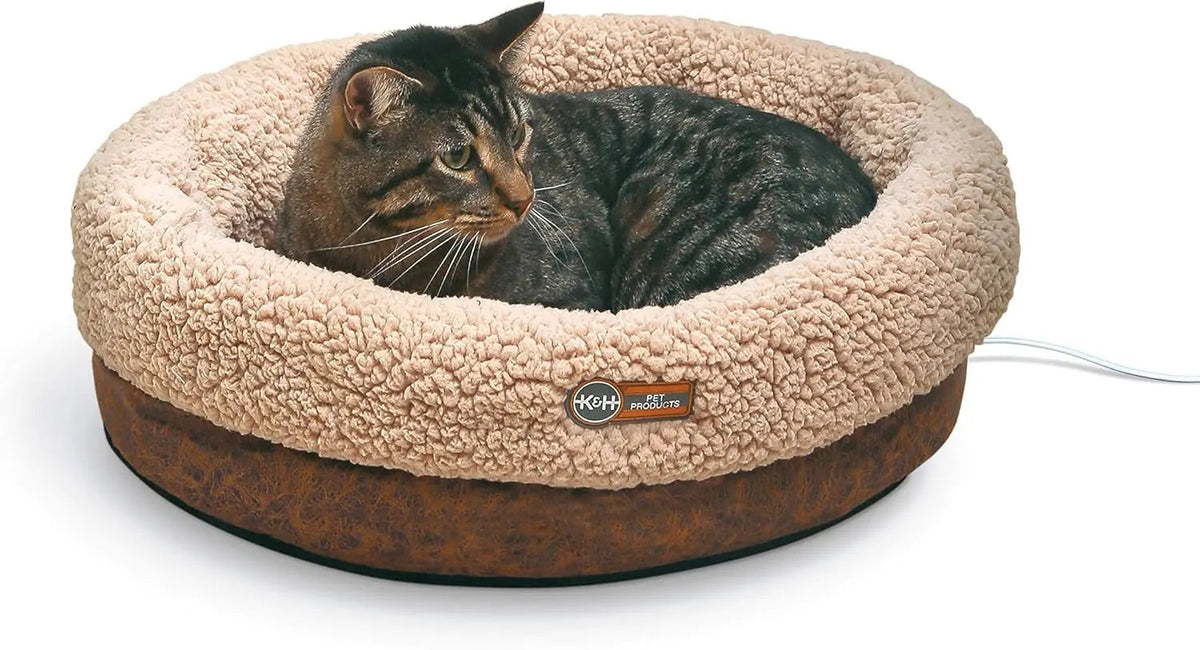 Cat resting in a Chocolate K&H Thermo-Snuggle Cup heated cat bed