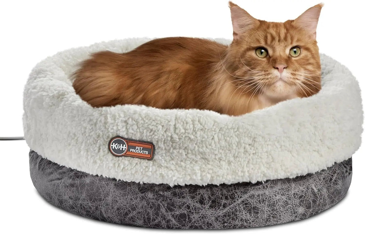 Cat resting in a gray K&H Thermo-Snuggle Cup heated cat bed
