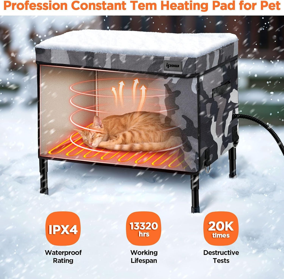 Heating pad warming the inside of an outdoor cat house in snow