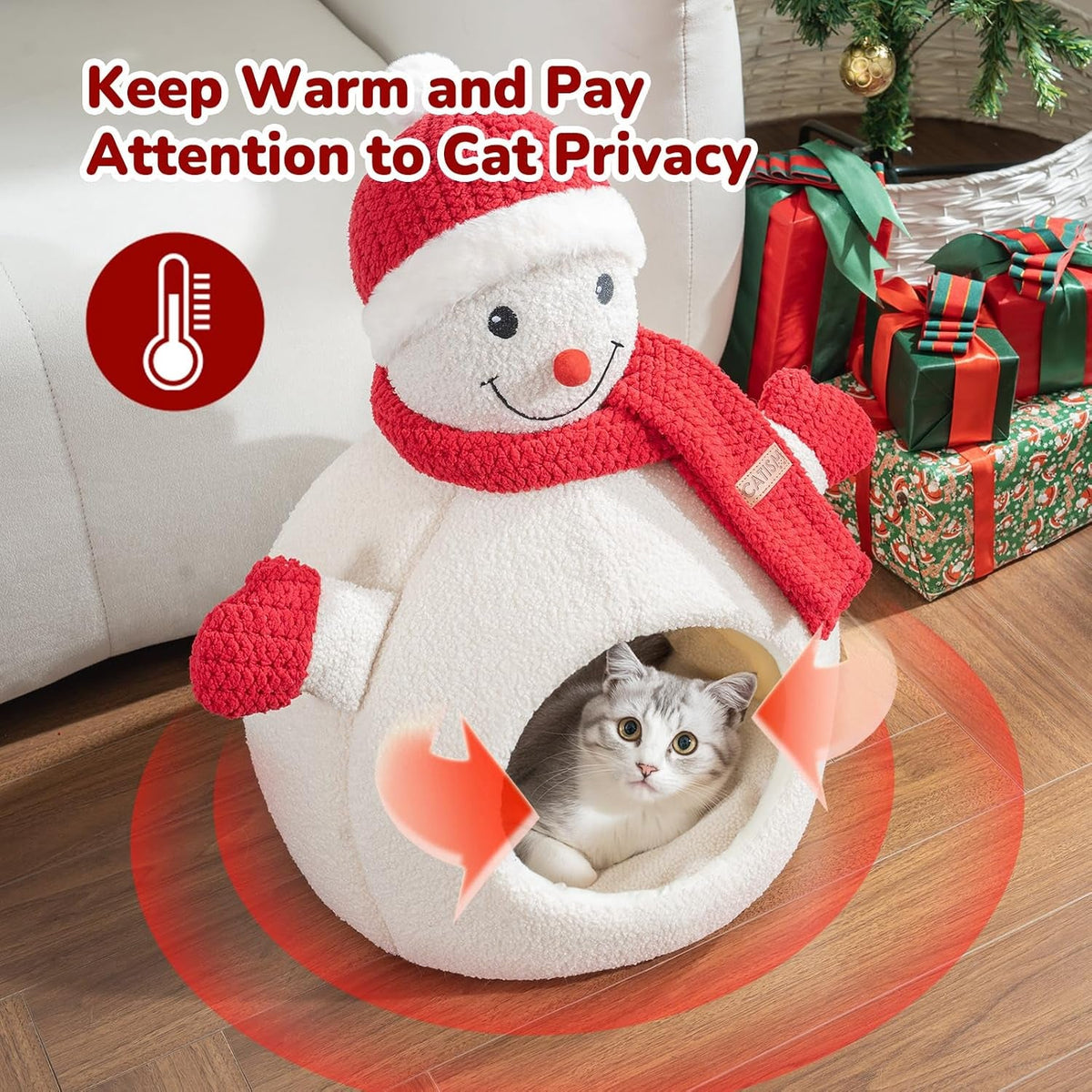 Cat resting inside warm snowman cave bed by Christmas gifts